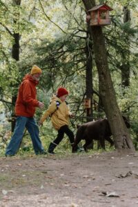 A man, a child and his dog - How to Raise a Compassionate Child